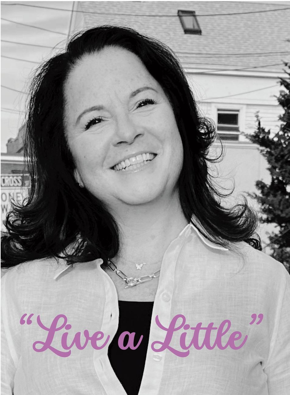 Diane Trounson-Chaiken smiling, with her motto "Live a Little"