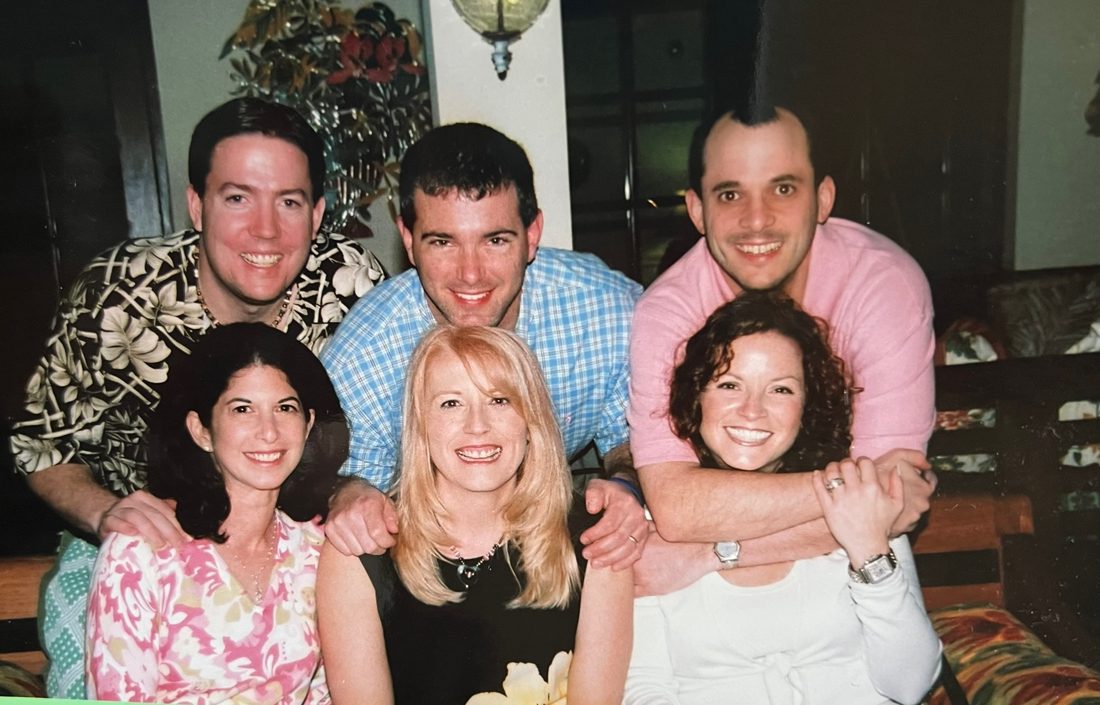 Diane with two other couples at their 40th birthday celebration, posed together on a couch