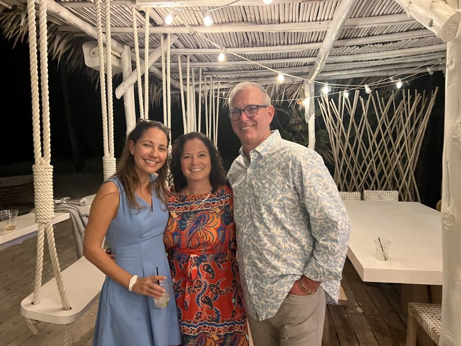 Diane with friends on a beach deck
