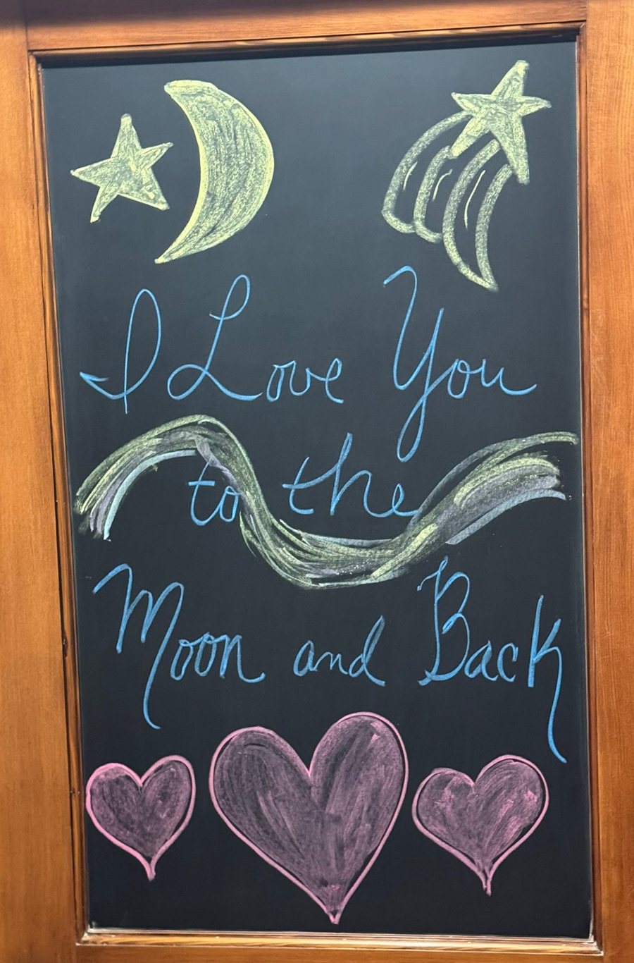 Diane's chalkboard message: I Love You to the Moon and Back, drawn with a moon, stars and three hearts