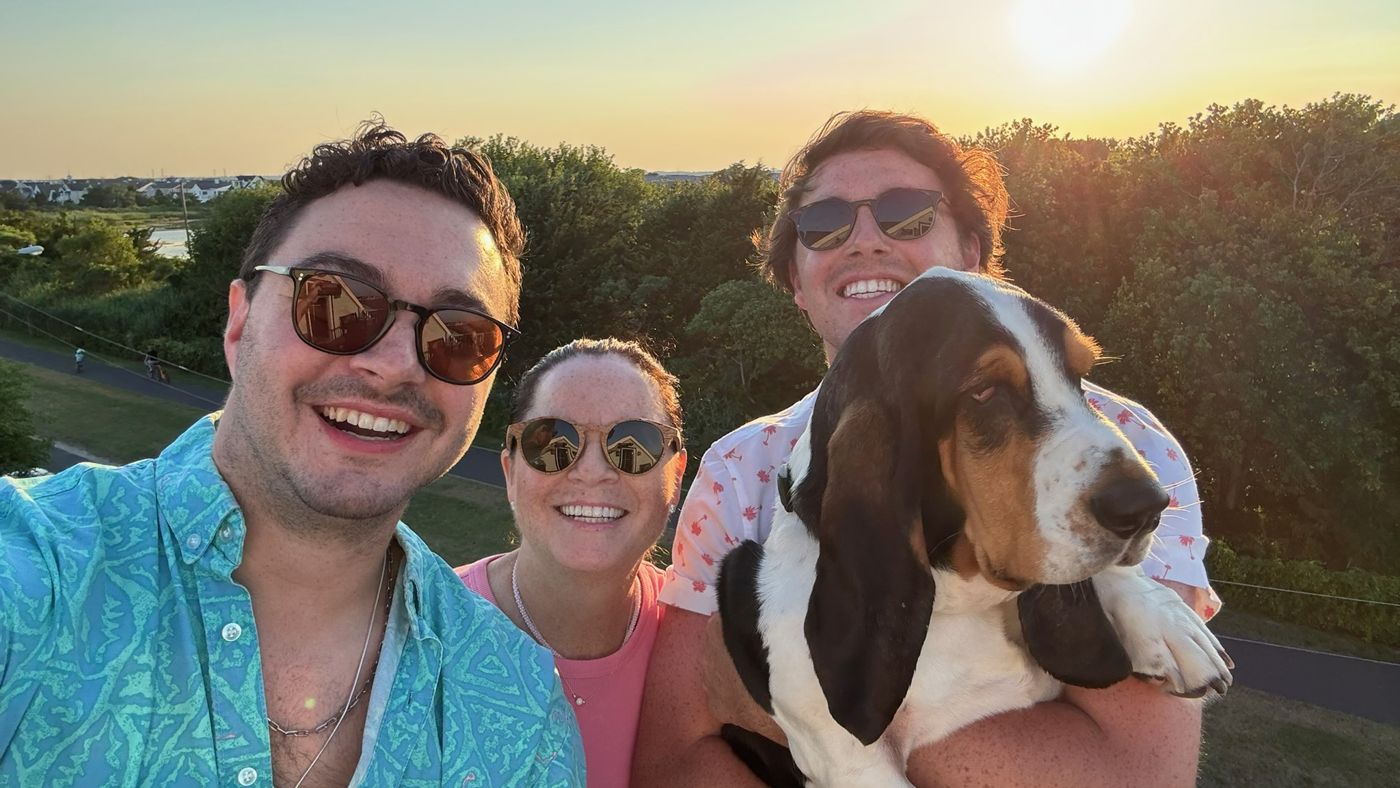 Diane with her sons and their basset hound at sunset